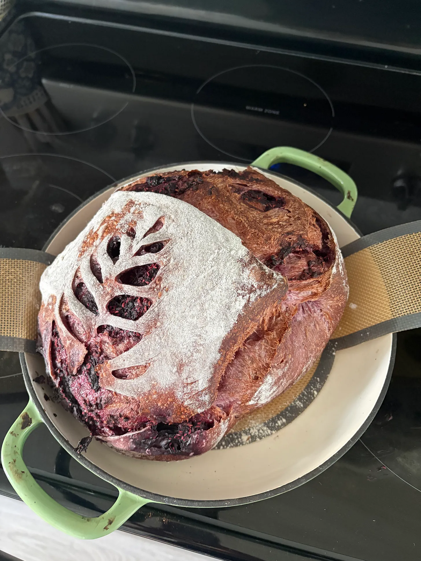 Sliced tri berry sourdough loaf showing purple crumb